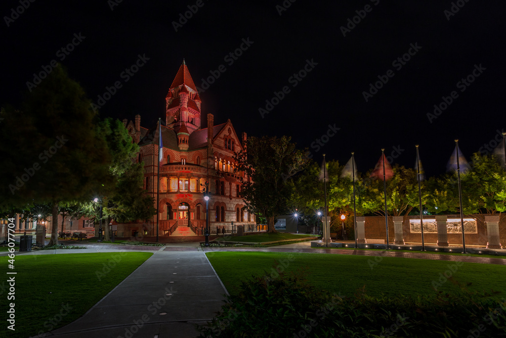 Fototapeta premium Beautiful historical Courthouse in downtown of Sulphur Springs, Texas. Building illuminated at dusk