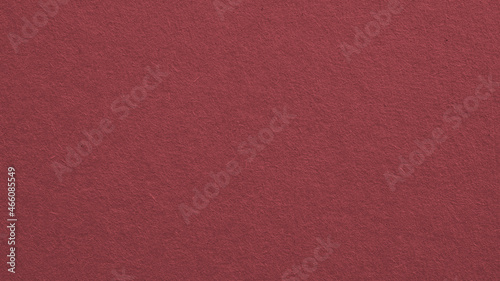 The surface of brown cardboard. Paper texture with cellulose fibers. Dark paperboard background or wallpaper. Textured graceful and the home backdrop. Macro