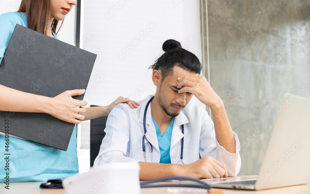 Team of asian doctors and businesswoman having a meeting in medical office.Closeup portrait, young depressed woman healthcare in despair, isolated hospital. Team of asian doctors and businesswoman having a meeting in medical office.Closeup portrait, young depressed woman healthcare in despair, isolated hospital.