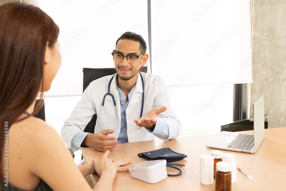 Medicine and health care concept. Asian male doctor is taking care patient in hospital.Doctors are using a stethoscope to check lungs and heart. Medicine and health care concept. Asian male doctor is taking care patient in hospital.Doctors are using a stethoscope to check lungs and heart.