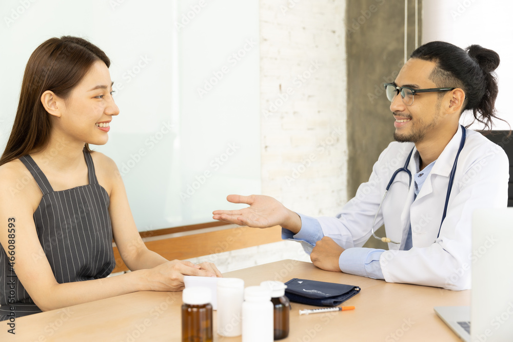 Medicine and health care concept. Asian male doctor is taking care patient in hospital.Doctors are using a stethoscope to check lungs and heart. Medicine and health care concept. Asian male doctor is taking care patient in hospital.Doctors are using a stethoscope to check lungs and heart.