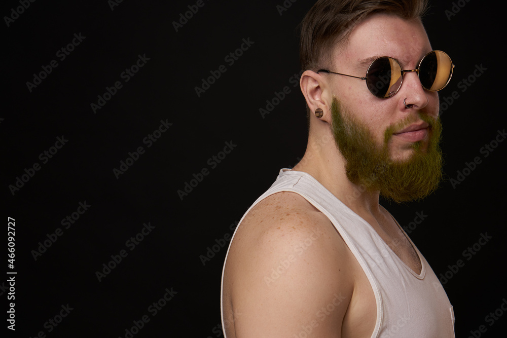 bearded man in white t-shirt with tattoos on his arms posing bully bearded man in white t-shirt with tattoos on his arms posing bully