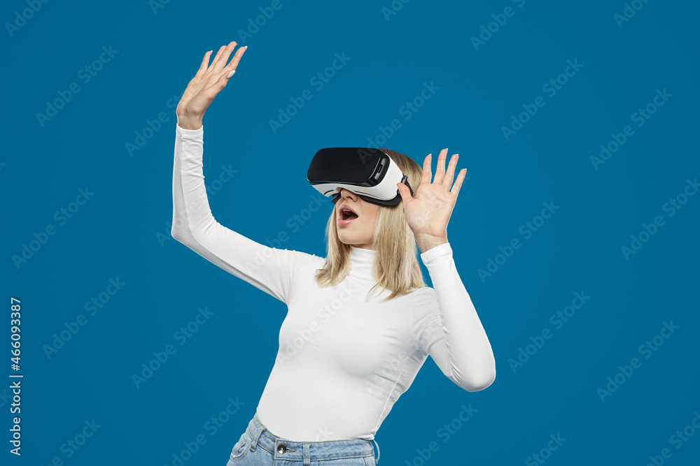 Excited woman playing game in virtual reality glasses Excited woman playing game in virtual reality glasses