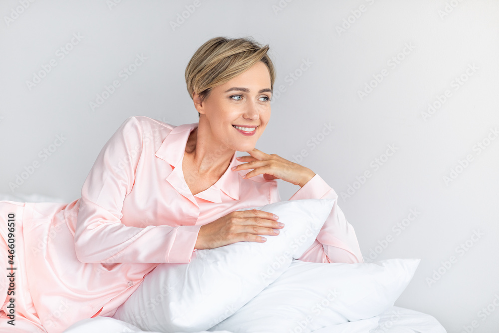 Happy woman looking away and thinking in comfy bed Happy woman looking away and thinking in comfy bed