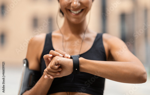 Fitness Tracker. Unrecognizable Athlete Lady Looking At Smartwatch, Checking Sport Activity