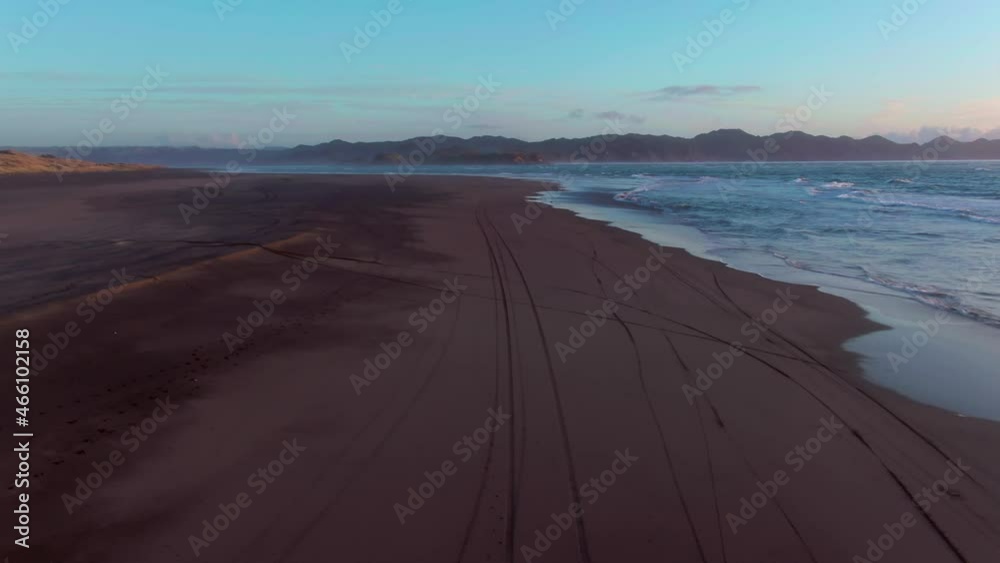 Aerial: Kawhia Hot Water Beach at sunset, Waikato, New Zealand Aerial: Kawhia Hot Water Beach at sunset, Waikato, New Zealand