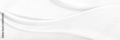 White gray satin texture that is white silver fabric silk panorama background with beautiful soft blur pattern natural.