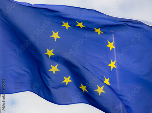 Official flag of the European Union in front of a blue sky