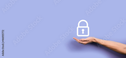 Male hand holding a lock padlock icon.Cyber security network. Internet technology networking.Protecting data personal information on tablet. Data protection privacy concept. GDPR. EU.Banner