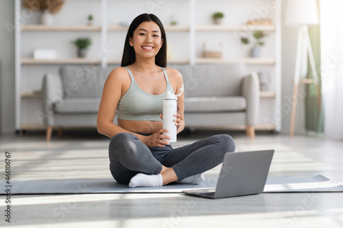 Portrait Of Smiling Young Asian Woman Training With Laptop Computer At Home Free Download Portrait Of Smiling Young Asian Woman Training With Laptop Computer At Home - GFXLoad
