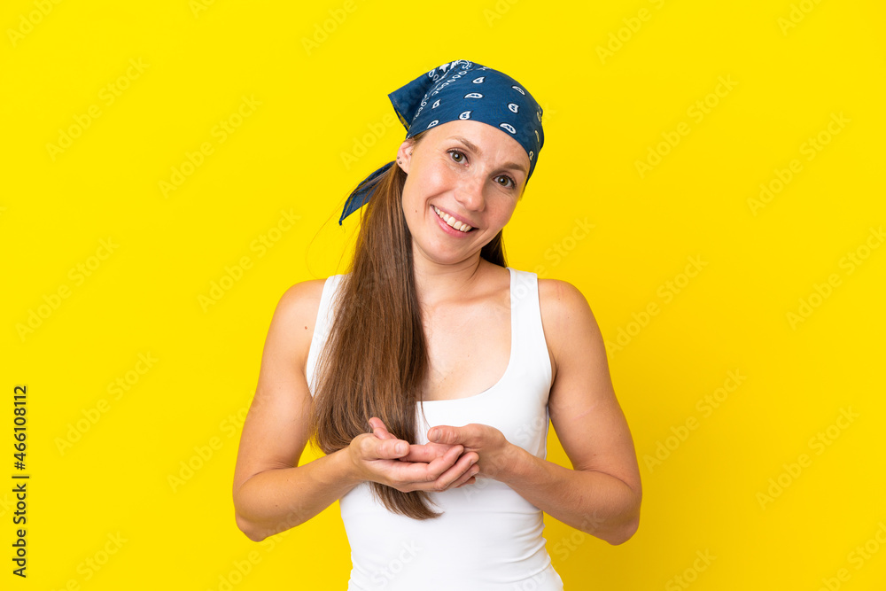 Young English woman isolated on yellow background laughing Young English woman isolated on yellow background laughing
