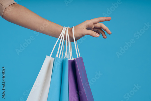 cheerful woman with packages in hands Shopaholic isolated background