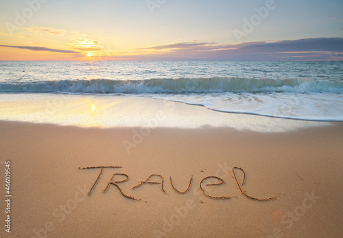 Travel word on the sea sand.