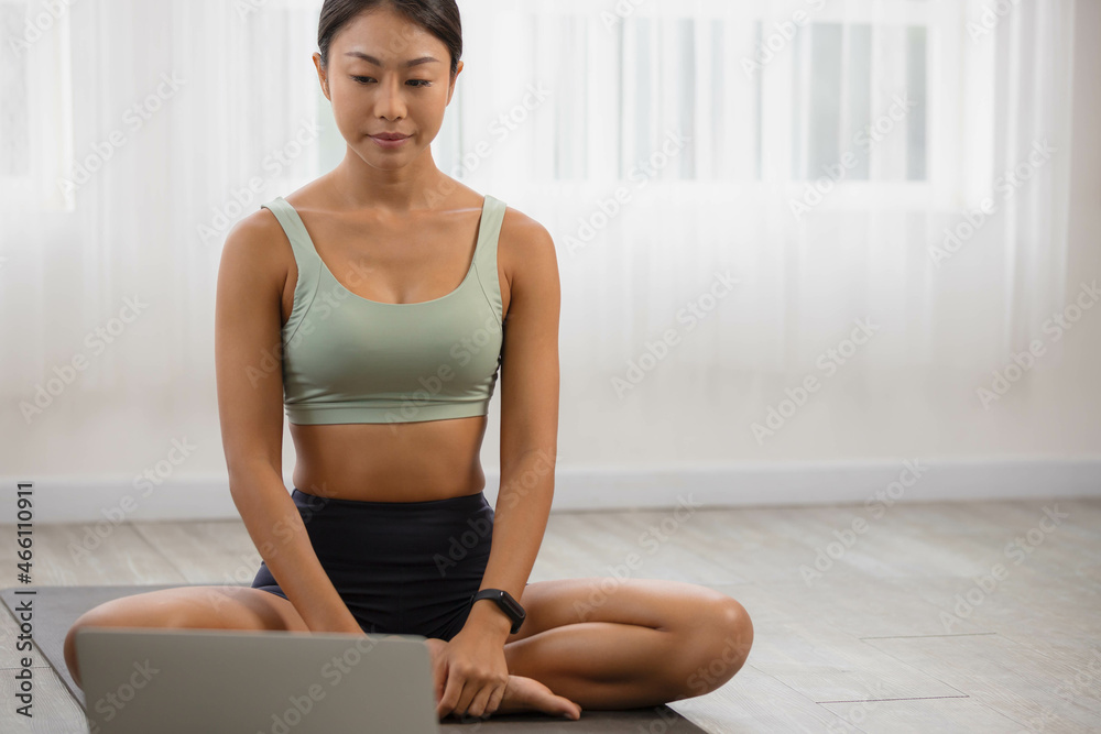 Morning yoga with an Asian woman, sitting in Easy position, Sukhasana posture, and meditating online. Morning yoga with an Asian woman, sitting in Easy position, Sukhasana posture, and meditating online.