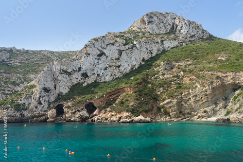cliffs and mountain landscape on the Mediterranean coast turquoise blue water of the Cala de la Granadella bay in Spain