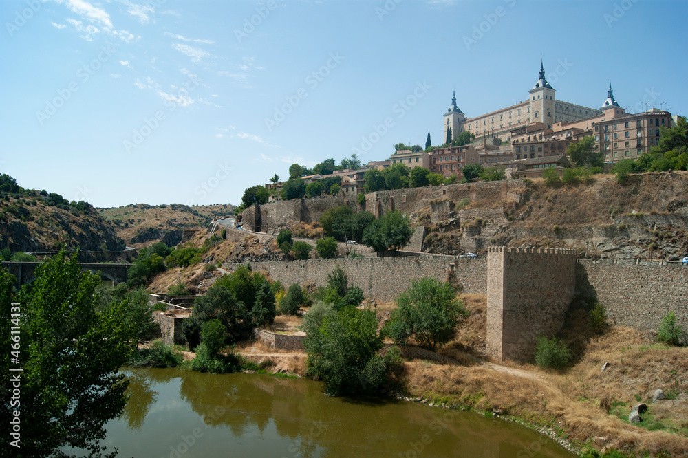 The imposing El Alcazar fortress at Toledo, Spain. Historic medieval monument dominating the beautiful old Spanish city.  Landscape aspect view with copy space.