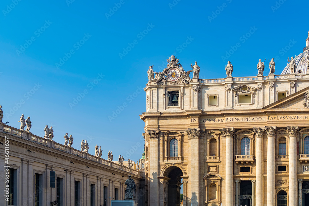 A part of main facade and Arch of the Bells Entrance of St. Peter's Basilica in the Vatican city, Rome, Italy
