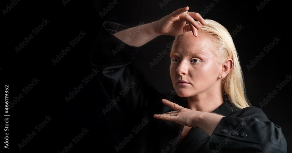 Portrait of an albino woman on a black background Portrait of an albino woman on a black background