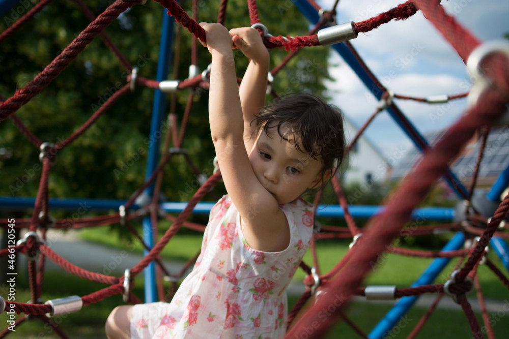 child playing in the playground child playing in the playground