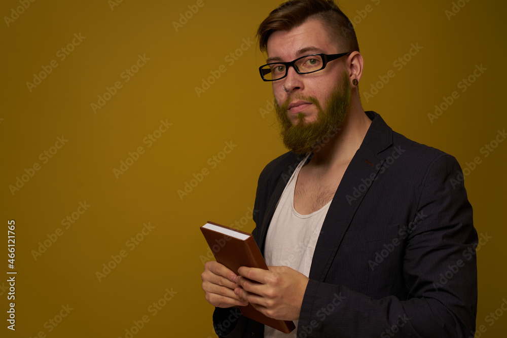 business man with glasses notepad in the hands of a studio official business man with glasses notepad in the hands of a studio official