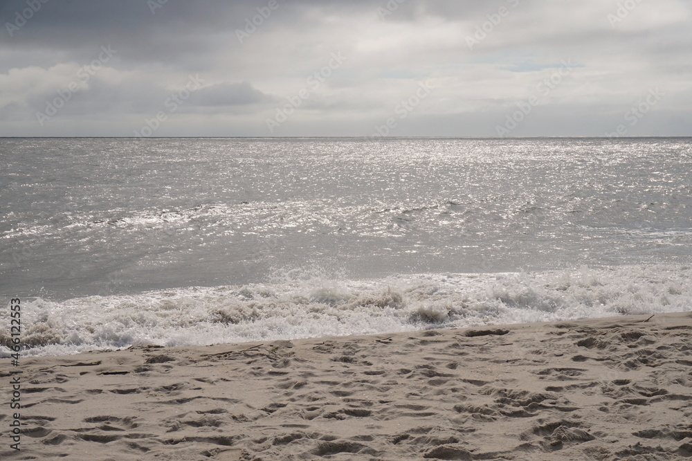 Blue Sky Clouds Gently Breaking Surf on the Beach