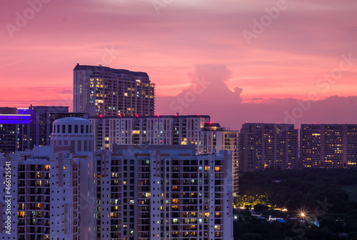 Beautiful sunset in Gurgaon,Haryana,India skyline during Covid 19 pandemic on September 04,2021.Exterior view of urban, modern cityscape with residential apartments in Delhi NCR's posh locality.
