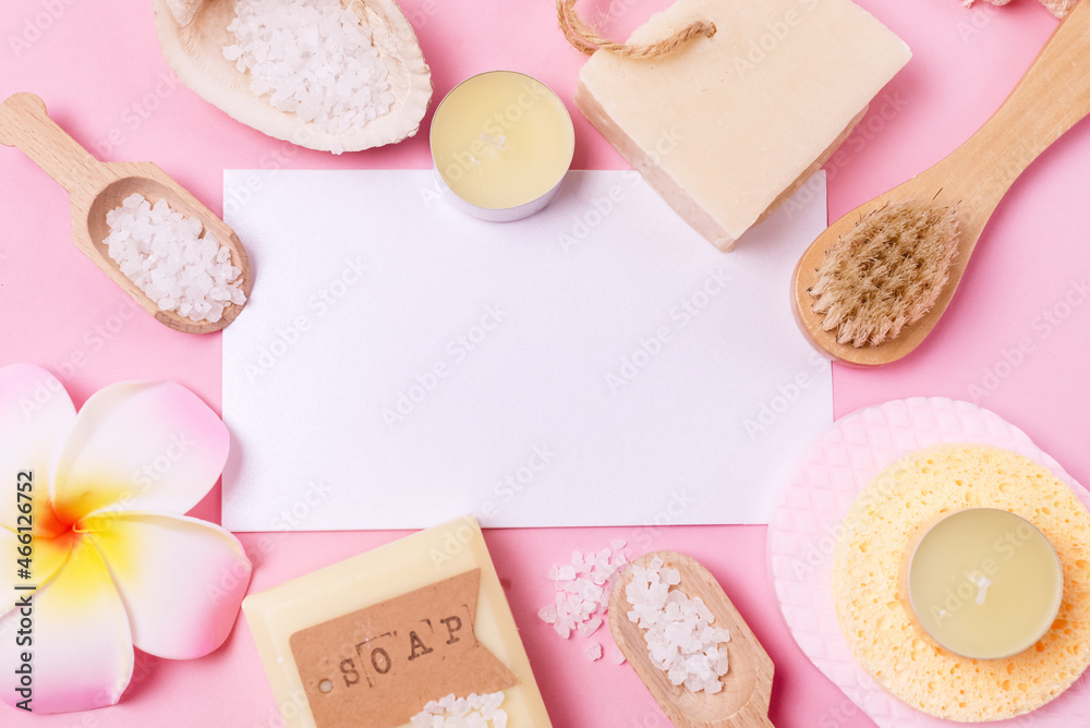 Sea Salt Aroma Candles Face Sponges and Bamboo Face Brush Plumeria Flower Natural Soap Pink Background Copy Space SPA Frame Top View Horizontal Wellness Sea Salt Aroma Candles Face Sponges and Bamboo Face Brush Plumeria Flower Natural Soap Pink Background Copy Space SPA Frame Top View Horizontal Wellness