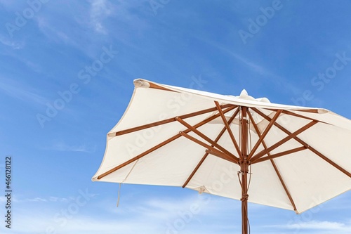 White parasol and sky on a sunny day