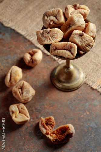 Dried figs in an old brass dish.