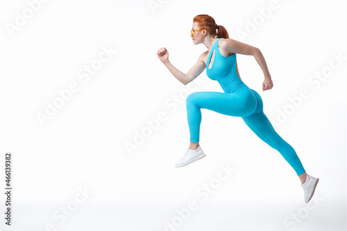 Young sportswoman leaping during training