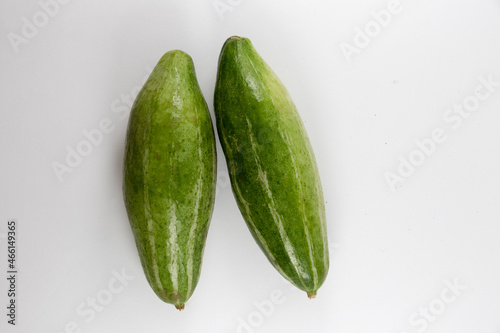 Whole pointed gourds or potol or parwal green vegetable isolated on white background. top view. close up photo