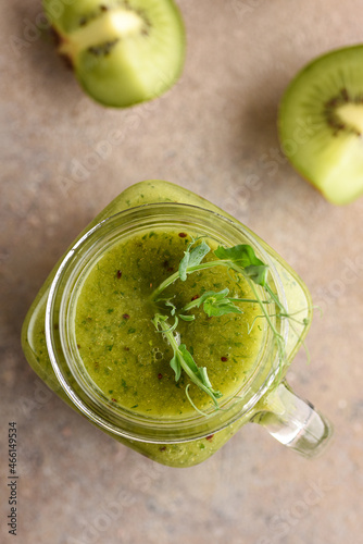 Green smoothie made from kiwi and pea sprouts.