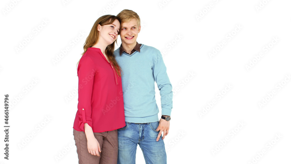 Young happy couple hugging and smiling while looking aside isolated over white background Young happy couple hugging and smiling while looking aside isolated over white background