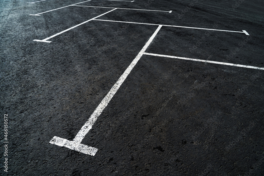 Road markings for parking on black asphalt. Selective focus