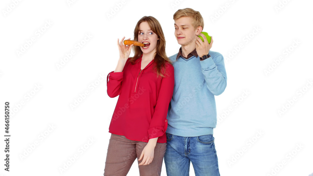 Funny teenagers posing at camera with fruts and vegetables isolated on white backgroud Funny teenagers posing at camera with fruts and vegetables isolated on white backgroud