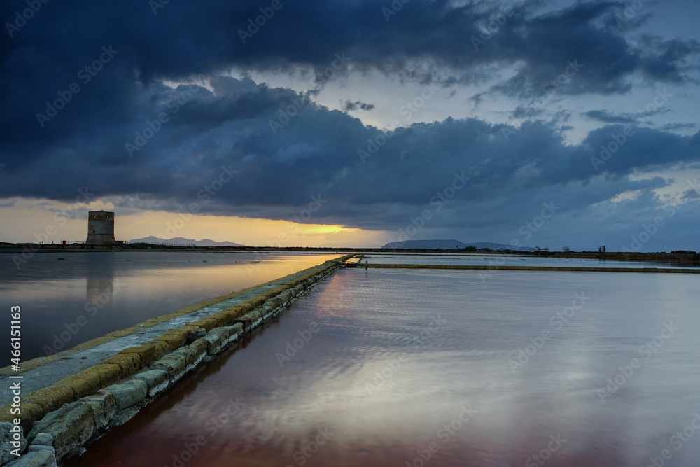 Nubia tower and Paceco salt flats after the sunset, Trapani, Sicily, Italy