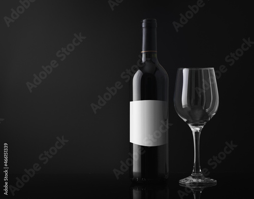 wine bottle with an empty glass