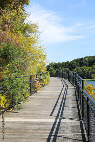 Wooden bridge over the river.  Autumn in Rochester, New York © Debbi Truax