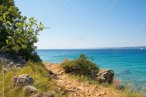 A coastal path south of the town of Punat on Krk Island in Primorje-Gorski Kotar County in western Croatia during late summer 
