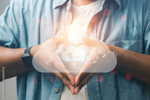 business man showing hands heart-shaped virtual interface of the cloud-based online money industry network