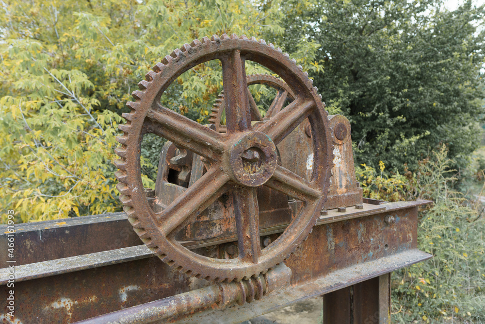 old mechanical metal gears mechanism on the abandoned dam old mechanical metal gears mechanism on the abandoned dam