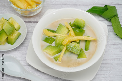 Thai dessert, melon and yellow jackfruit Topped with sugar syrup, fresh coconut milk and pandan leaves add aroma