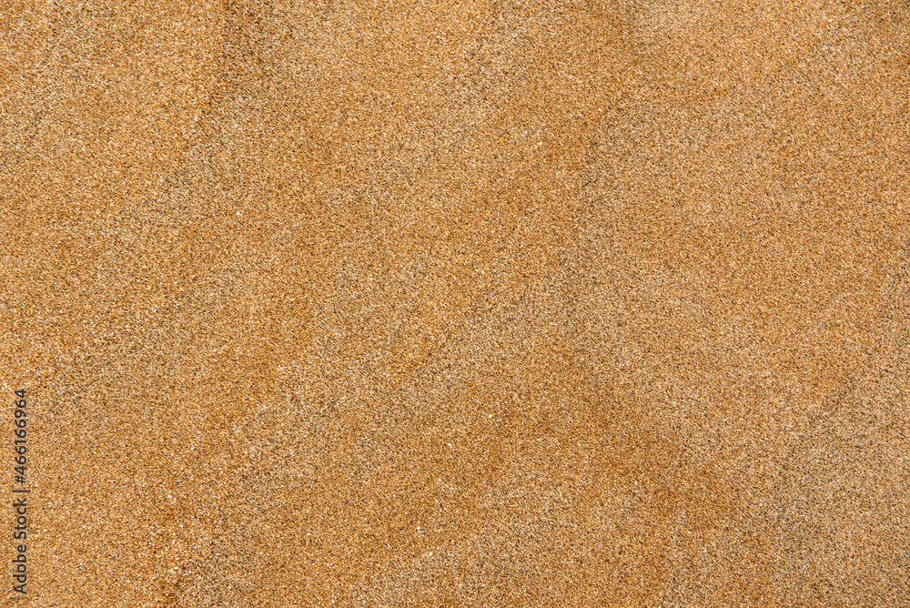 Textural background of yellow orange sand of the sea or desert Textural background of yellow orange sand of the sea or desert