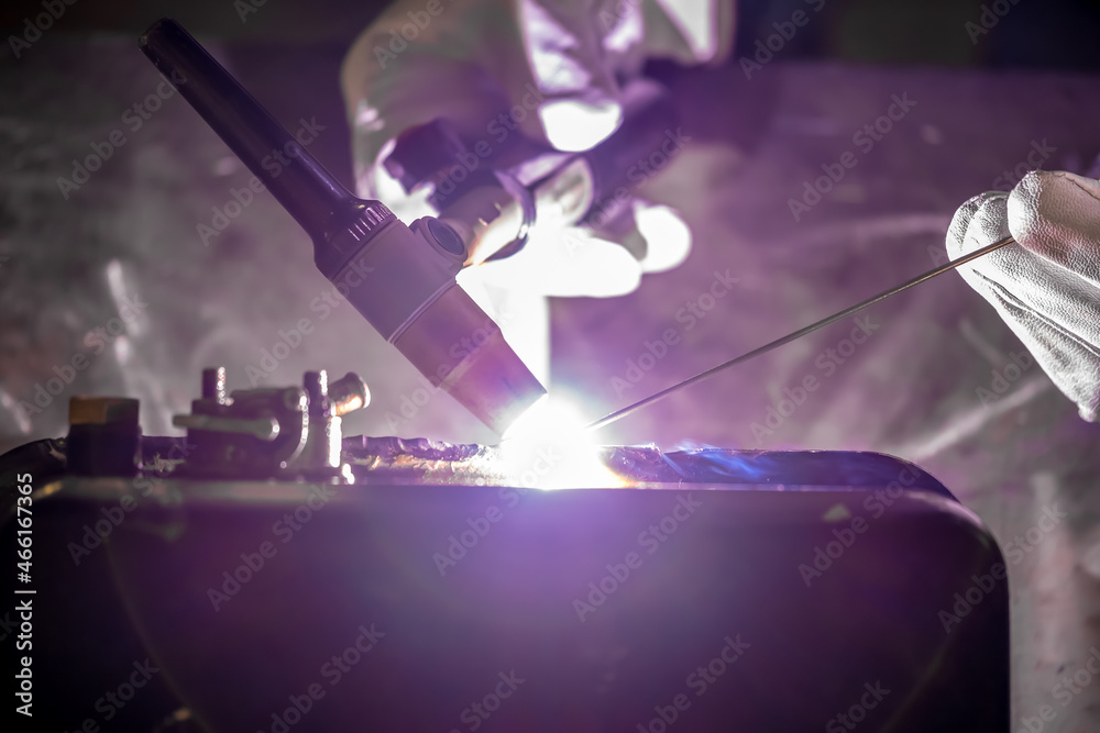 TIG welding. Welding the fuel tank of a motor pump by electric arc