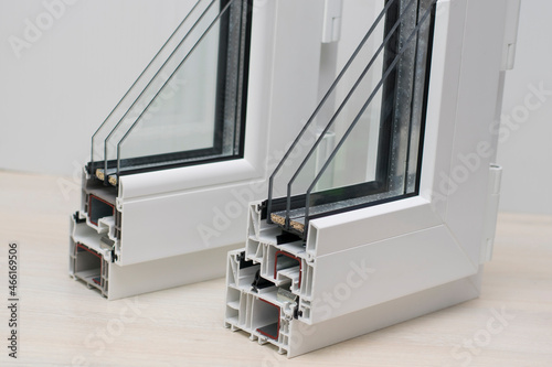 Samples of sectiona plastic windows in a section. close-up. PVC window profiles and double-glazed windows, exhibition samples. Energy saving technologies, plastic pvc windows.