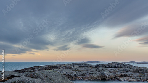 Blue sky, sea, nice cliffs. View of the archipelago in northern Gothenburg. A beautiful evening in Sweden. Place for text, copy space.	 photo