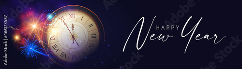 Happy New Year! Countdown. Clock and fireworks, lights and bokeh effect.