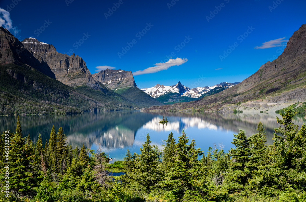 Mountains reflected in the mirror of St Mary Lake, Glacier National Park