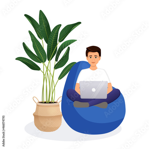 Man sits on a bean bag chair and works at a computer. Remote work, office at home, programming, freelance. Study at home in quarantine. Vector illustration.