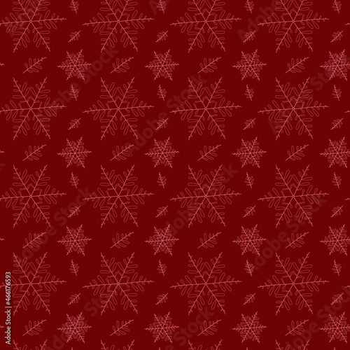 Seamless winter pattern of pink snowflakes on a red background for packaging and decoration